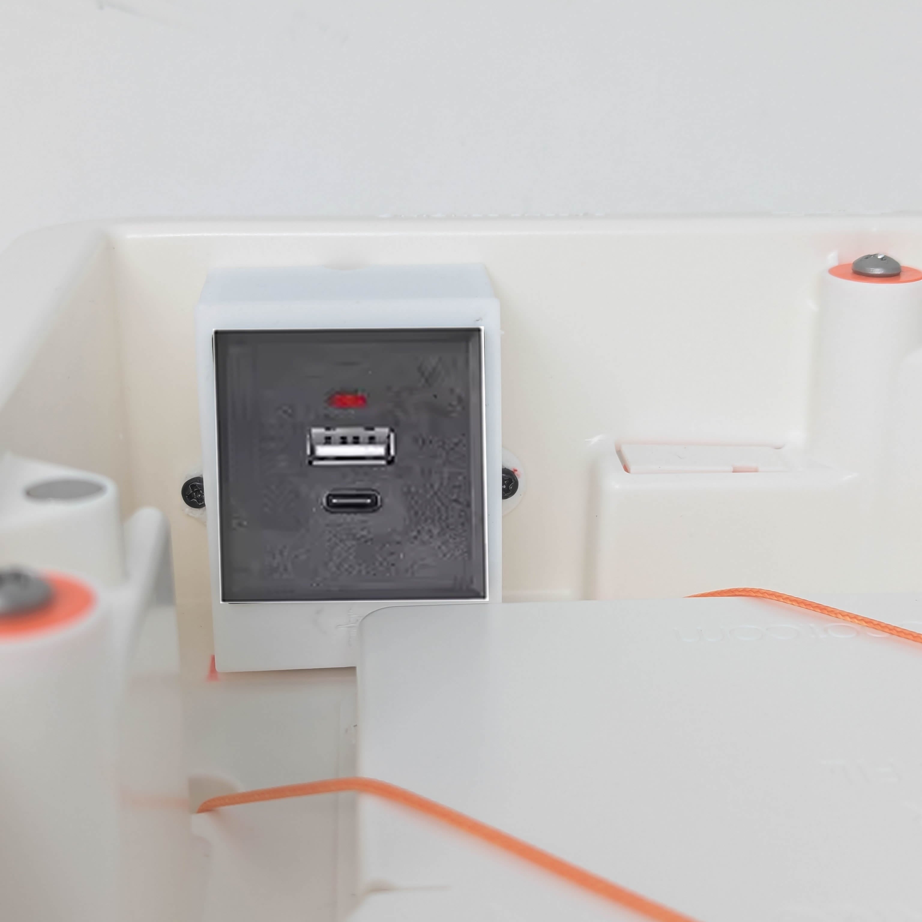 Recessed in-wall device enclosure with USB power outlet.
